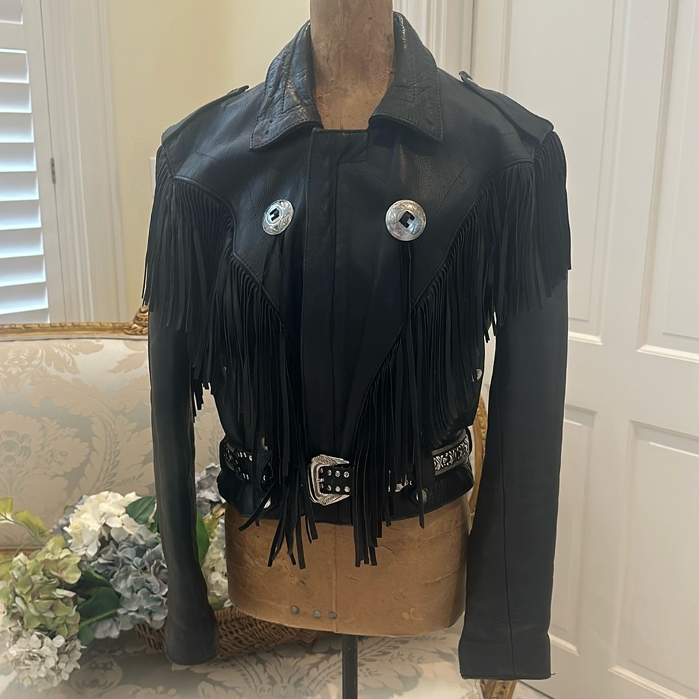 Vintage genuine, leather ladies, motorcycle jacket with fringe. Size medium.